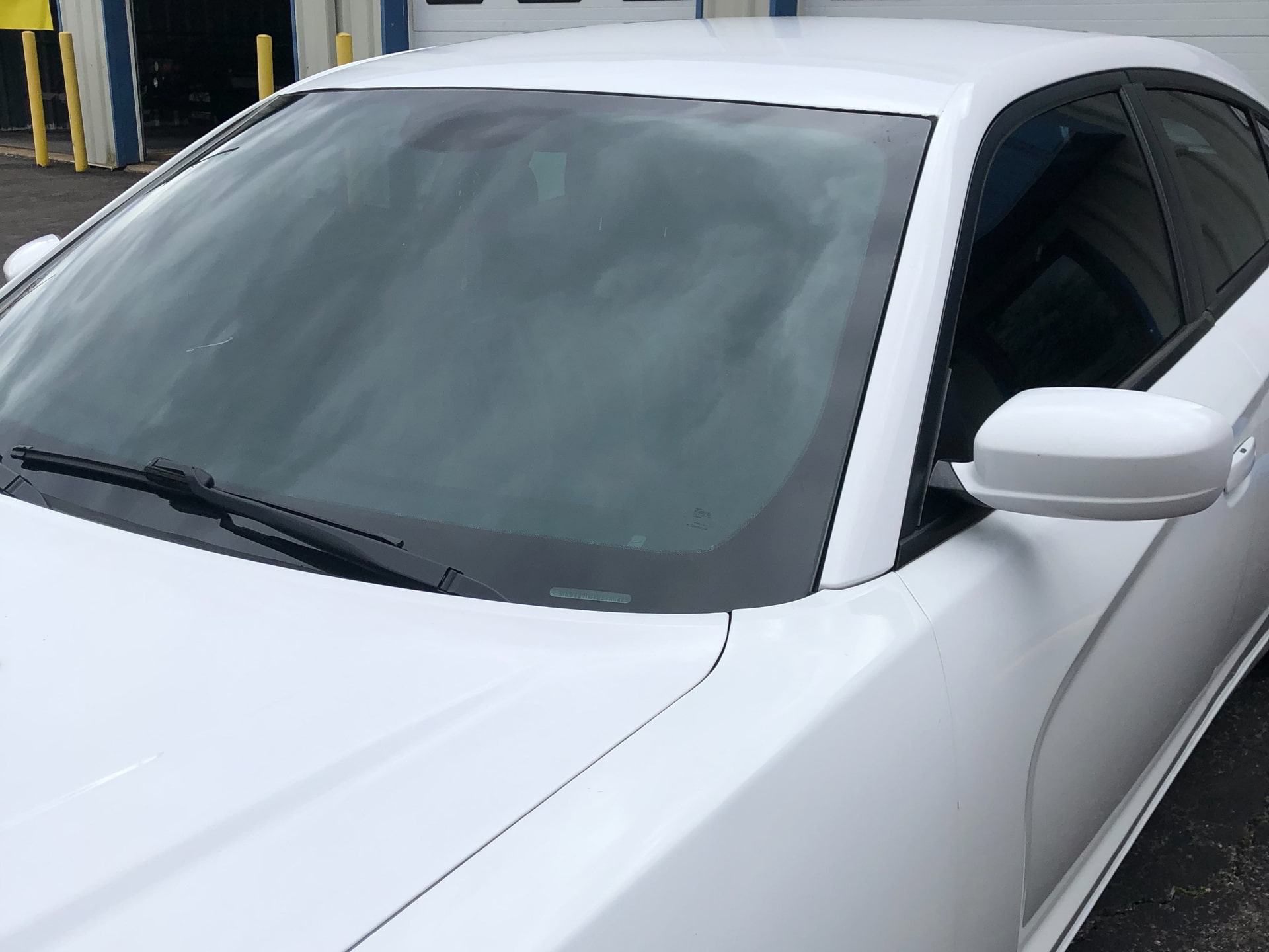 white car front windshield window tinting install dynamic detailing & tint odenton md
